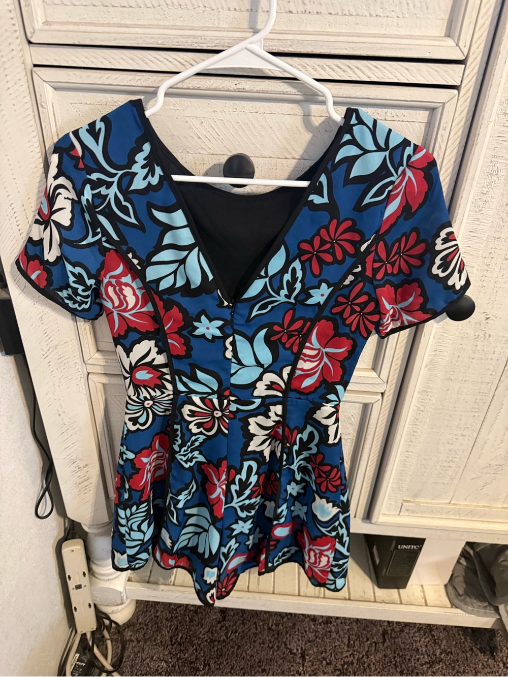Adelyn Rae Blue Floral V-Neck Romper with Red and White Accents